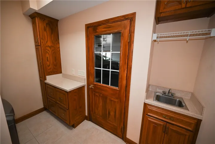 Laundry with cabinetry & sink