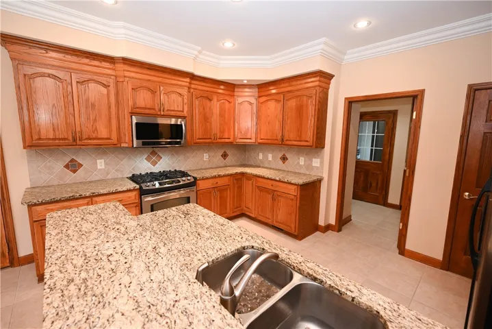 Kitchen with Van Nostrand Cabinetry, gas stove & walk in pantry!
