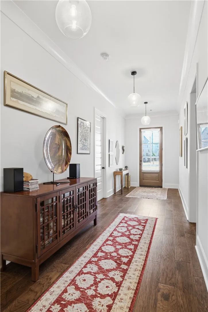The foyer offers a gracious welcome and the perfect backdrop for showcasing art.