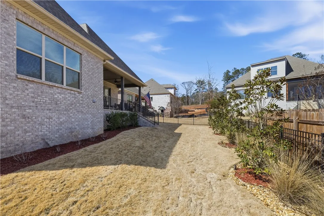 The wide rear yard provides generous space for recreation and outdoor enjoyment.