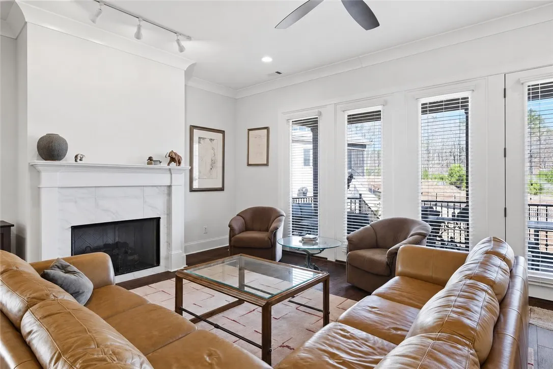 The soft neutral palette allows the furnishings and fireplace wall to take center stage.