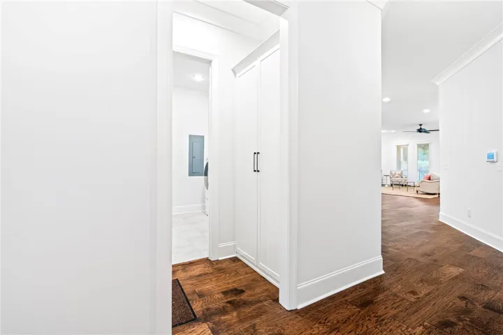 A custom California Closets built-in at the owner's entry serves as the perfect drop zone.