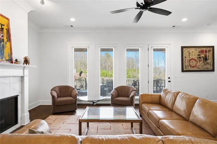 Ample seating centers on the gas fireplace while taking advantage of the full-light four-panel door system.