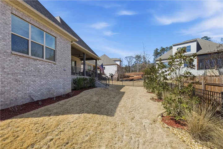 The wide rear yard provides generous space for recreation and outdoor enjoyment.