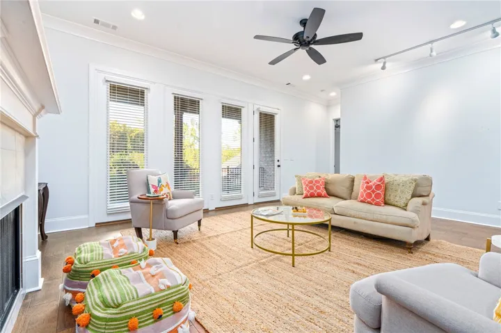 Ample seating centers on the gas fireplace while taking advantage of the full-light four-panel door system.