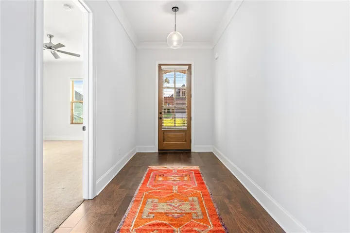 The foyer offers a gracious welcome and the perfect backdrop for showcasing art.