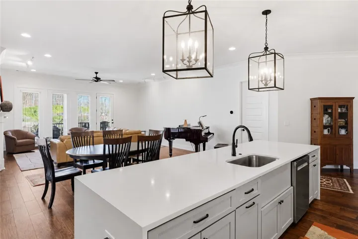 The layout promotes flow and connection between the kitchen, dining area, and living room.