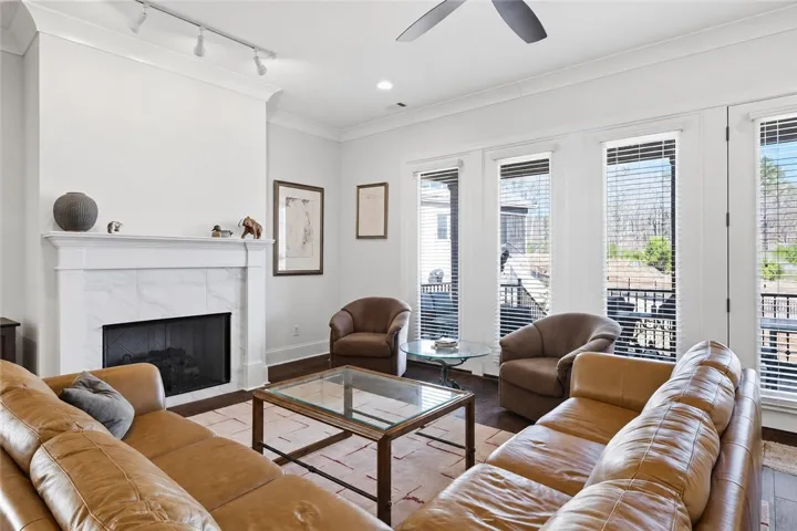 The soft neutral palette allows the furnishings and fireplace wall to take center stage.