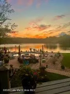 This tranquil waterfront retreat offers a private pool and captivating sunset views.