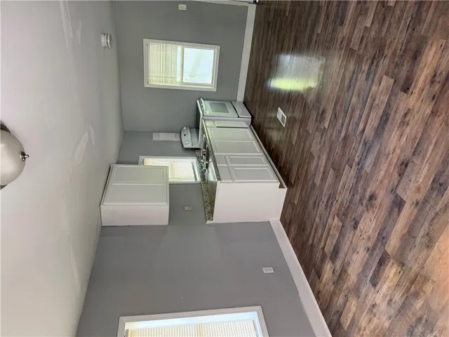 Functional kitchen with ample cabinet space, durable countertops, and sleek flooring.