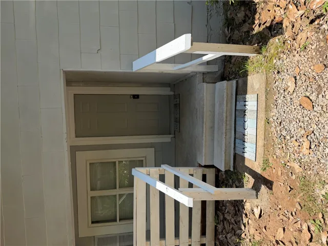 A welcoming entry point with a classic door and accessible steps.