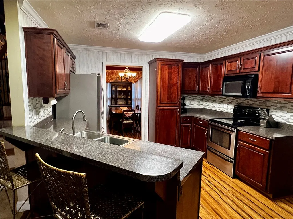 Raised Bar, Stainless Steel Appliances, Large Pantry Cabinet