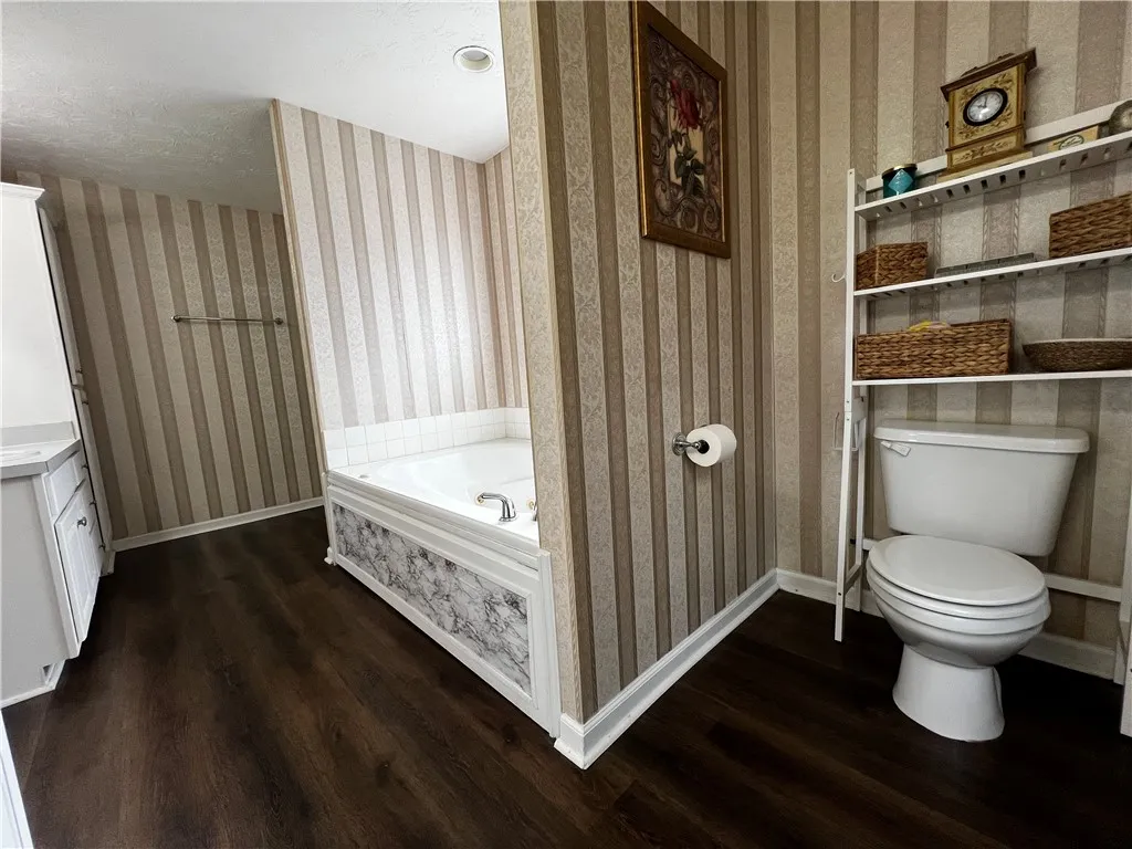 Separated Double Vanities, Shower, Bath and toilet area in Primary Bath.
