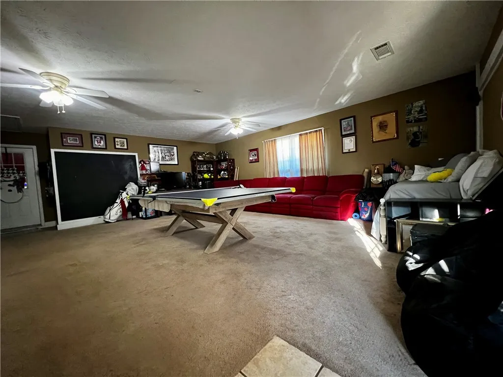 An inviting recreation room with abundant space for entertainment and relaxation.
