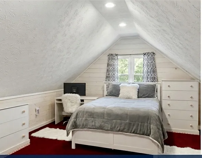 An inviting sleeping space features an architectural ceiling, providing a cozy and private retreat.
Note: Photo has been digitally altered to showcase different furniture arrangement.