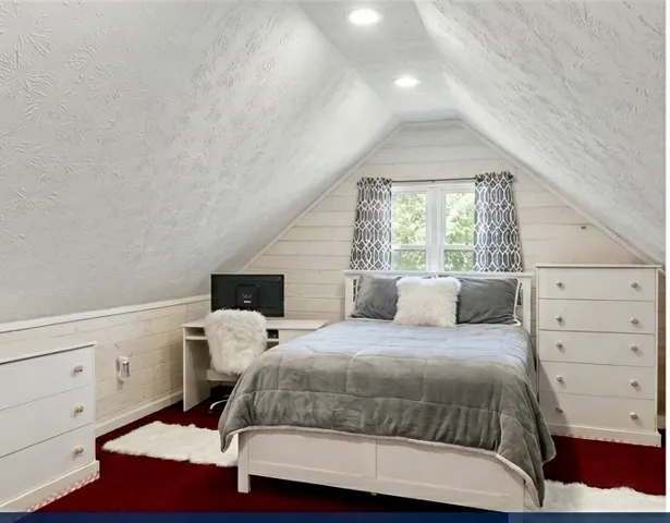 An inviting sleeping space features an architectural ceiling, providing a cozy and private retreat.
Note: Photo has been digitally altered to showcase different furniture arrangement.