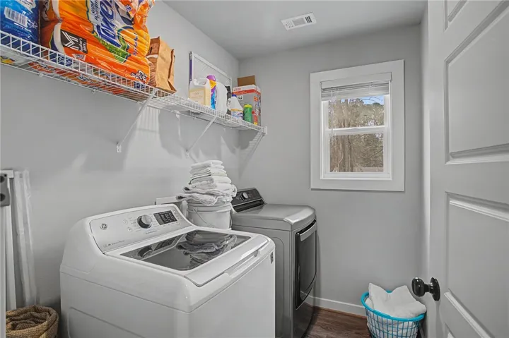 Laundry room upstairs in hall