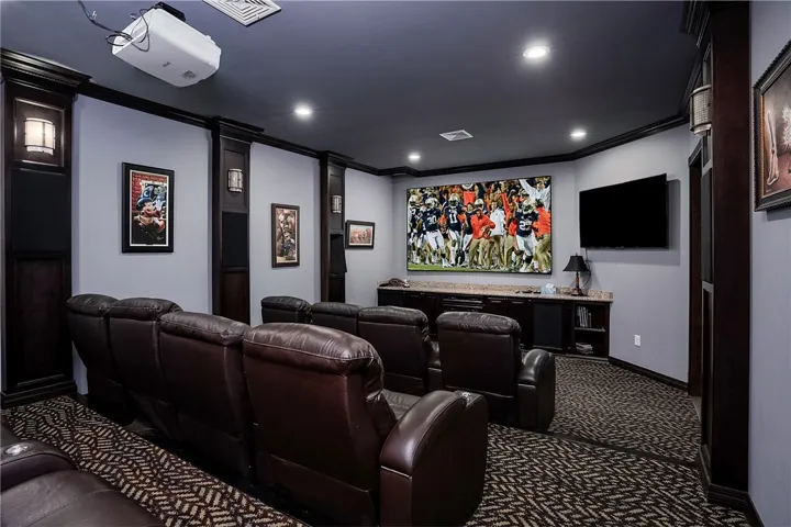 Theater Room with screen and TV. Theater seating and sound to remain.