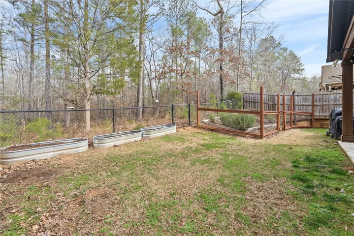 The backyard has wonderful gardening spots just waiting for you.