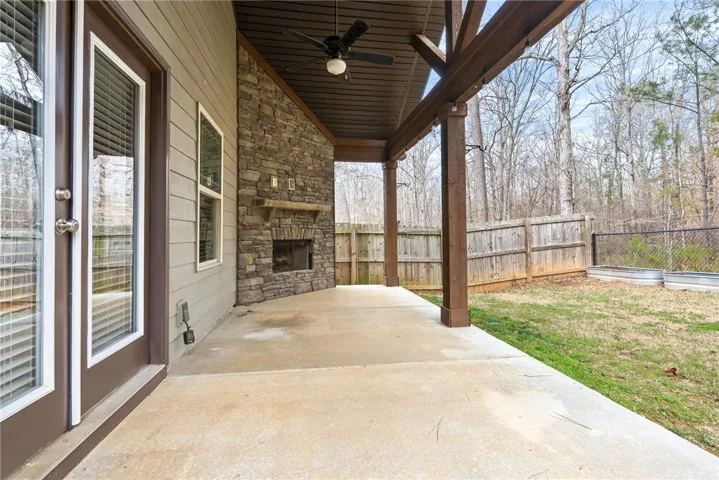 Enjoy relaxing on your Game Day back porch. No houses behind you, so you can enjoy your private wooded view.