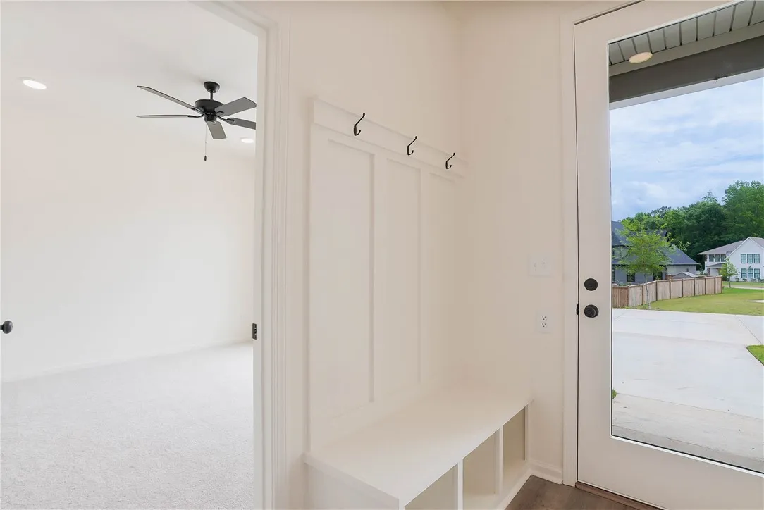 A built-in entry bench provides convenient storage at the home's welcoming entrance.