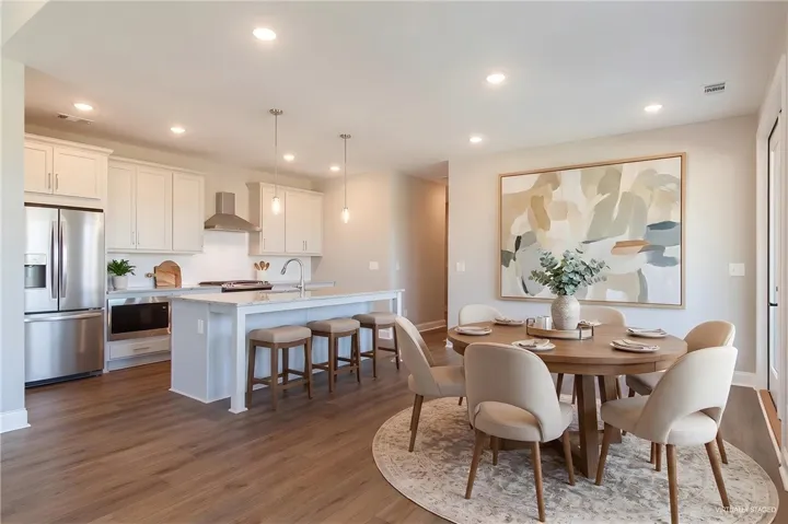 This spacious kitchen and dining area offers ample room for daily living and entertaining.