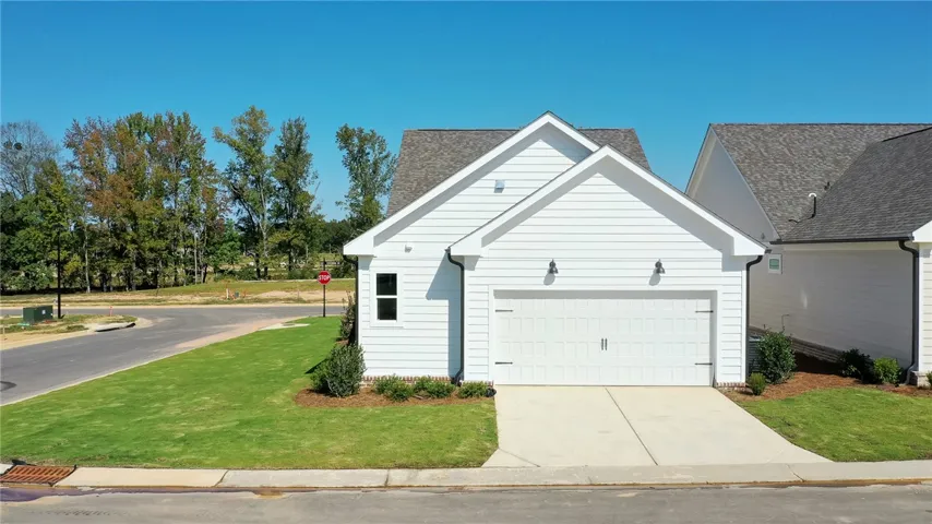 This charming residence features clean lines and a convenient attached garage.