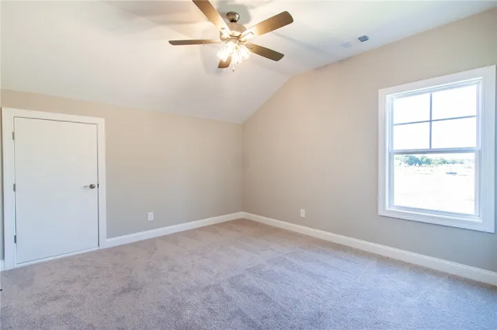 This spacious room features vaulted ceilings and ample natural light, perfect for peaceful relaxation.