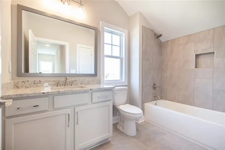 This bright bathroom features elegant finishes and a thoughtful design for daily comfort.
