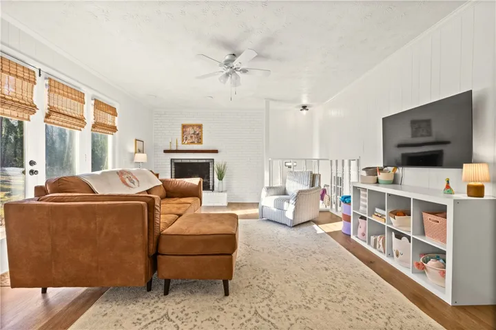 Also features double doors leading to back yard/patio & gas fireplace.