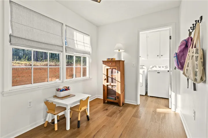 Breakfast space (or great spot for a drop zone or kitchen expansion!).  Garage access here too.