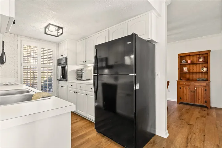 Add'l view of kitchen (fridge incl) looking toward dining room.