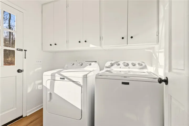 Laundry space w/cabinets & outside access.