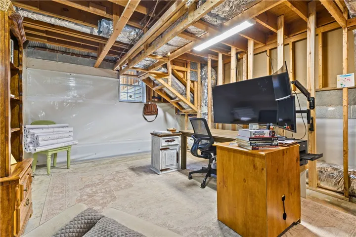 Basement space perfect for home office, gym, storage, etc.  Features a warrantied waterproof system to keep moisture outside.