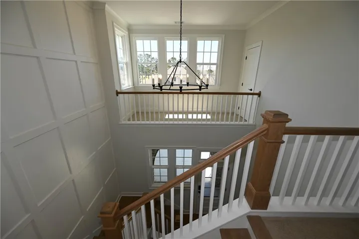 Beautiful balcony space overlooking the foyer.