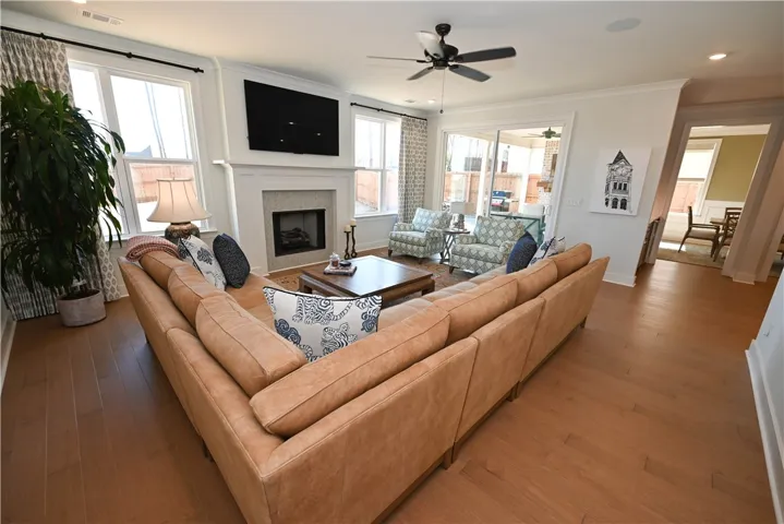 Hardwood flooring and a gas fireplace.
