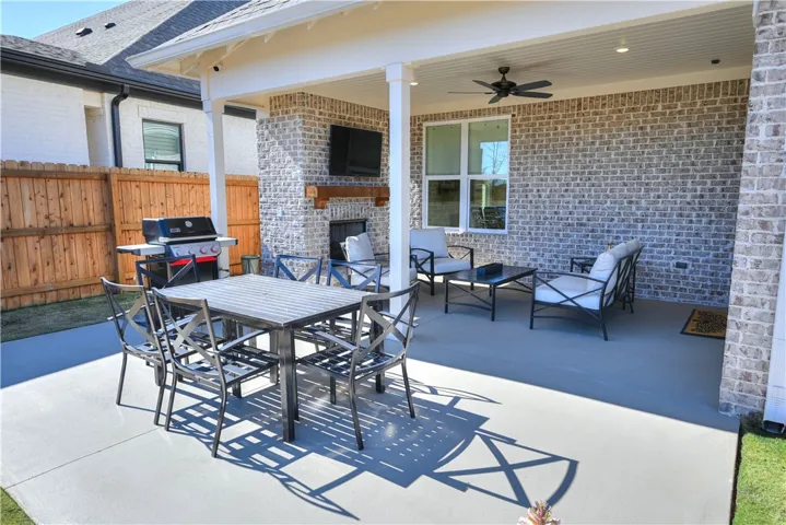 Back porch is finished with a built-in gas grill line, fireplace and tv space!