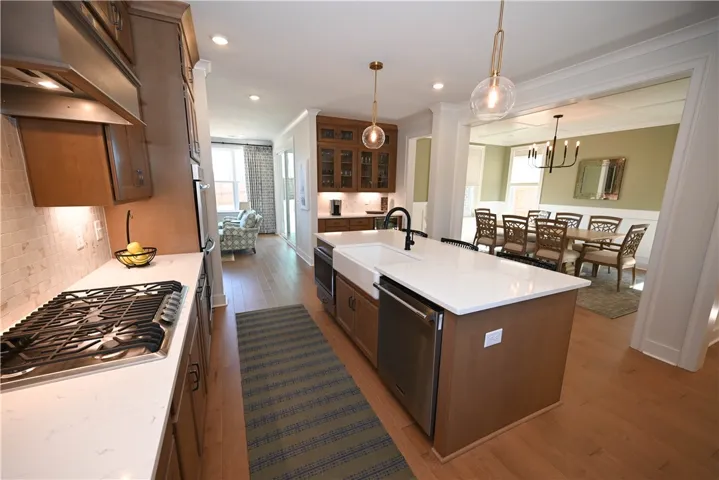 Ceiling height cabinetry with matching vent hood!