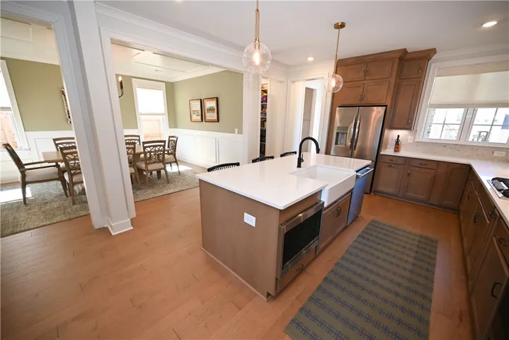 Stainless steel appliances, gas cooktop, double ovens and stunning quartz countertops.