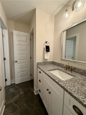 Upstairs bath with single vanity and linen closet