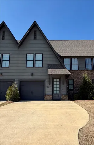 3 cars can park in the driveway plus 1 car garage