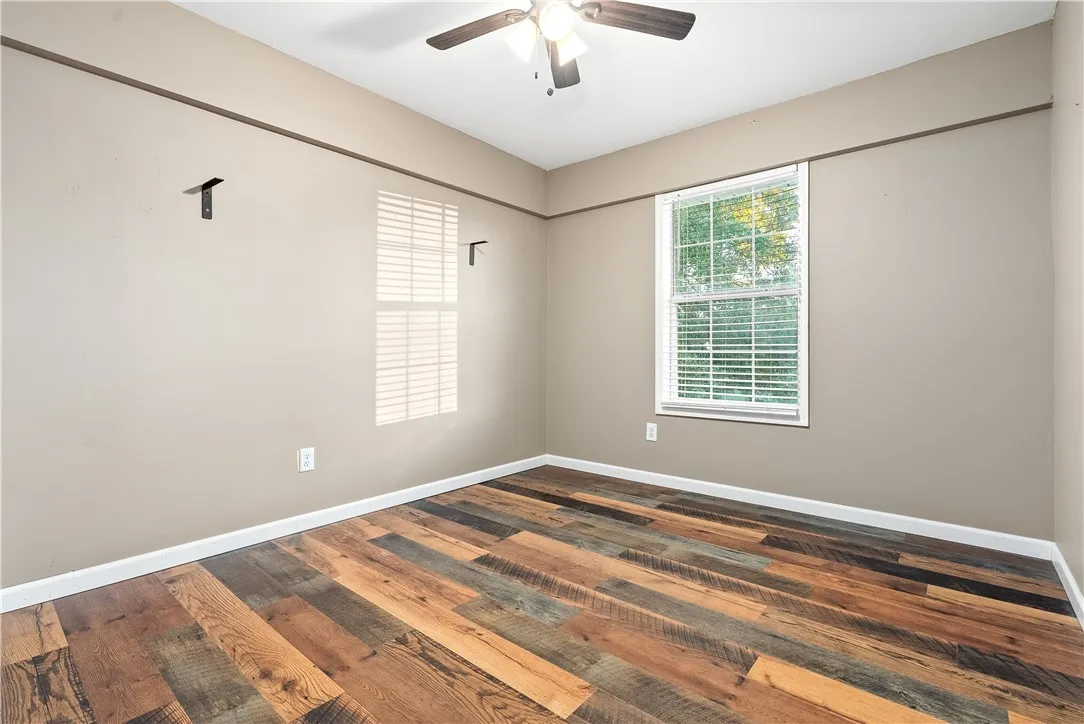 3rd Bedroom or flex space in main house. Was used as a gun room so it has a metal entry door. No closet as a chiffarobe was used for cloting.