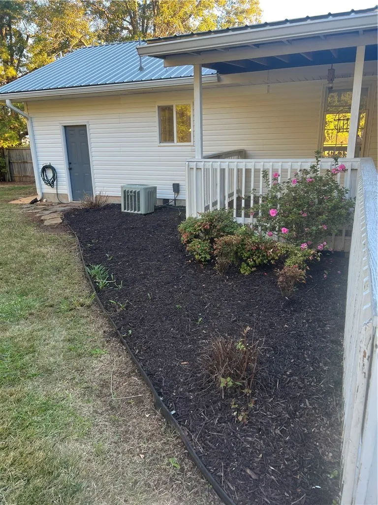 Rear of house has a metal door storage area with a lock
