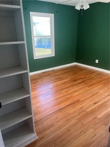 Bedroom with original builtin bookshelf