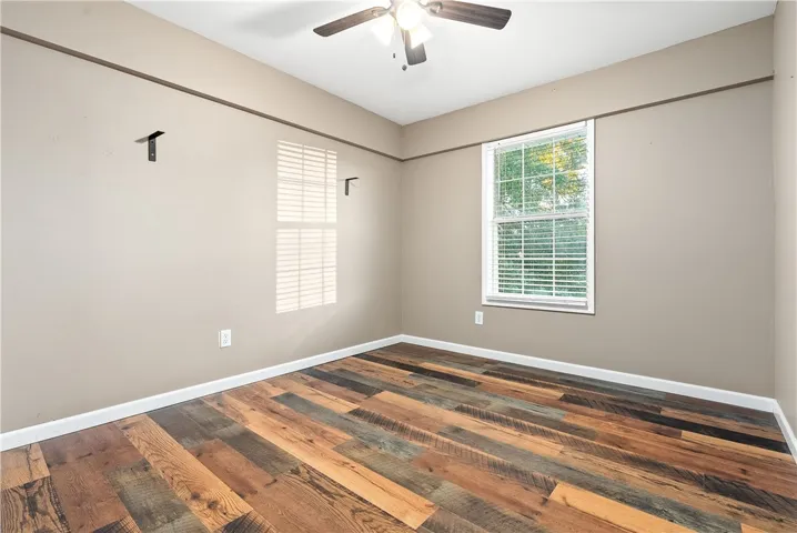 3rd Bedroom or flex space in main house. Was used as a gun room so it has a metal entry door. No closet as a chiffarobe was used for cloting.