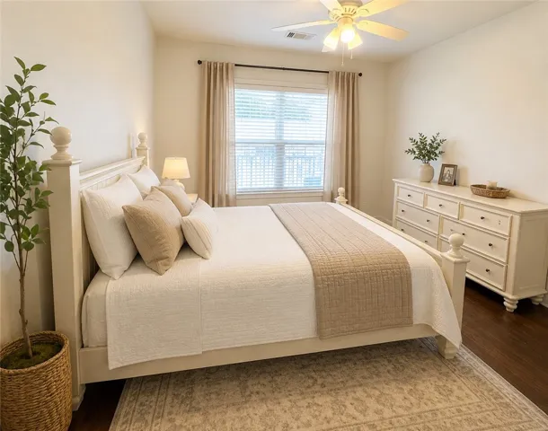 Relax in comfort with wood flooring and a refreshing ceiling fan.