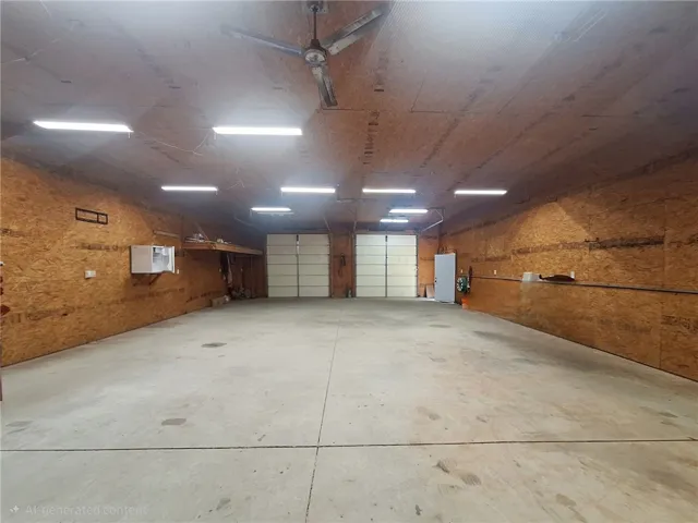 This spacious interior offers ample room for various uses and features practical overhead lighting.