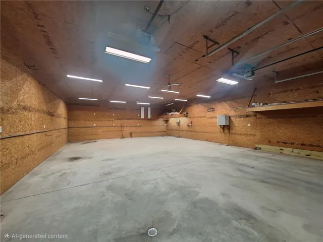 This spacious garage offers ample room for vehicles and storage, perfect for any enthusiast or hobbyist.