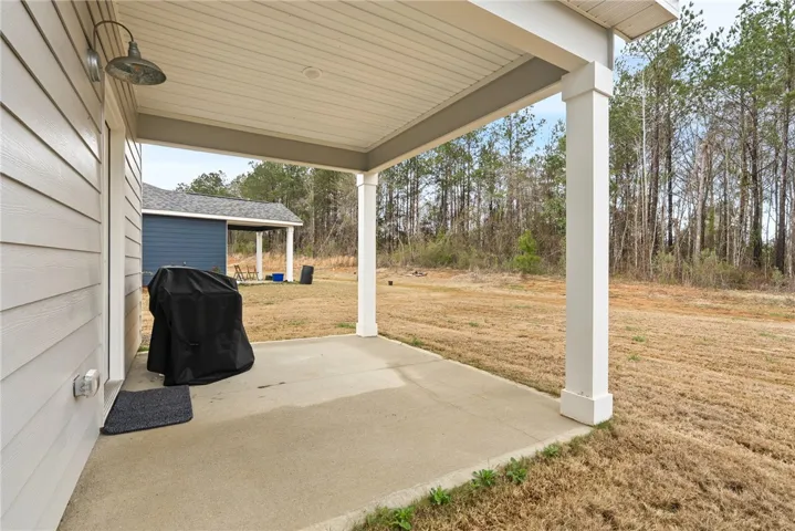 covered back patio to enjoy no matter what the weather