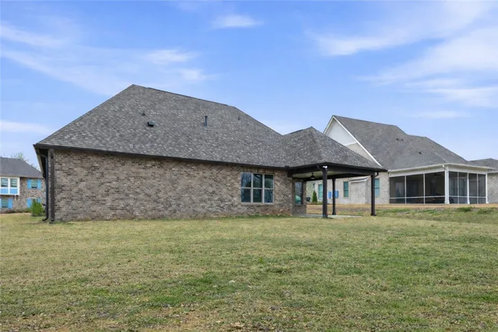 The expansive backyard provides plenty of room for play equipment, recreation, or future enhancements.